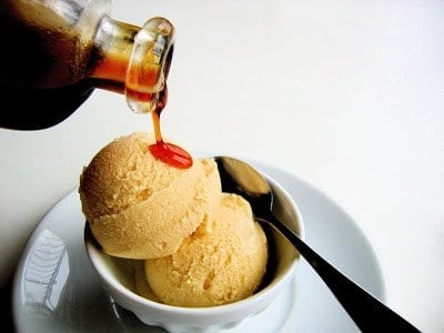 mugolio extract being poured onto ice cream