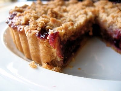 huckleberry fig crumble tart with slice taken out