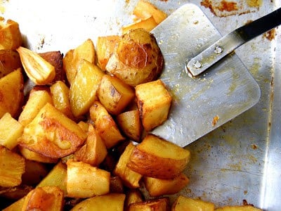 oven roasted potatoes and a spatula