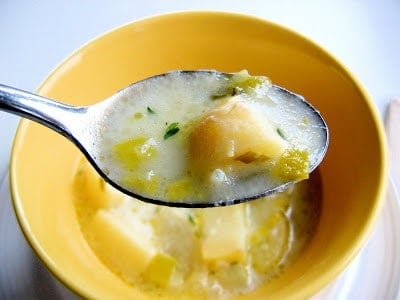 spoonful of creamy potage over a bowl