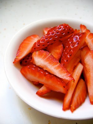 sliced strawberries in a bowl