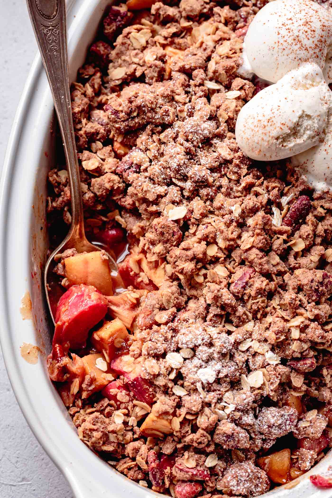 close-up of easy apple rhubarb crisp in a baking dish