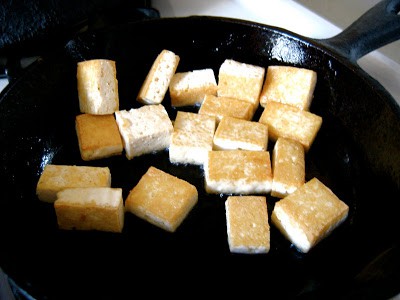 tofu cooking in a pan