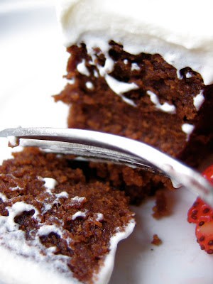fork cutting into chocolate cake
