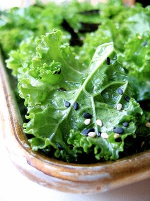 close up of sesame kale chips in a tray