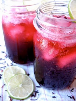 side shot of tequila spritzers in jars