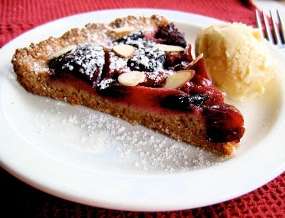 slice of plum tart with cardamom ice cream
