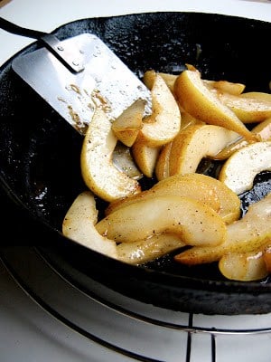 pears being cooked in a pan
