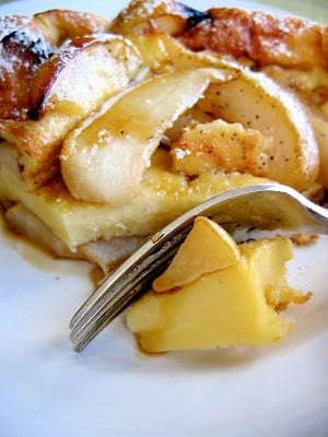 fork cutting into baked pancake 