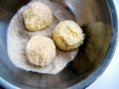 top down shot of balls of cookie dough in a bowl 