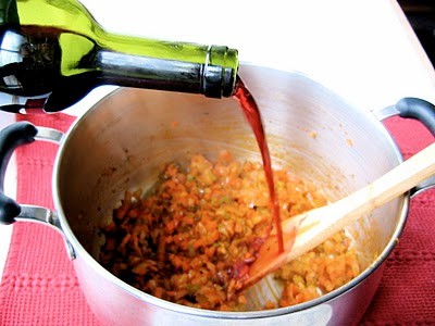 red wine being poured into pot