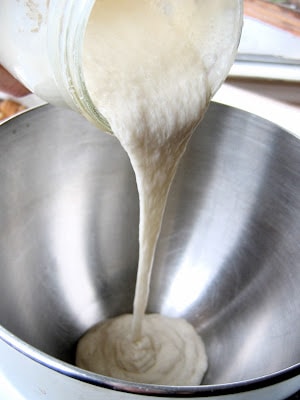 dough mix being poured into bowl 