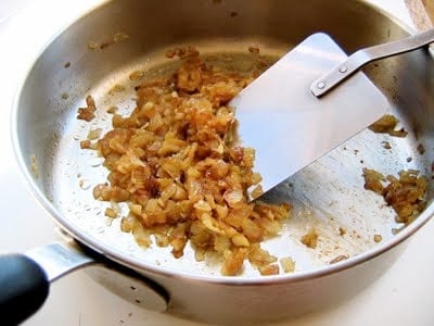 ingredients for vegan walnut lentil pate being cooked in a pan