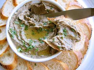 knife going into bowl of pate 
