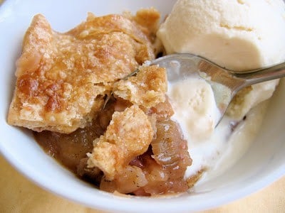 spoon in a bowl of apple rhubarb pandowdy