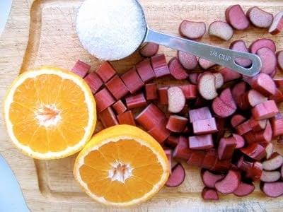 orange and chopped rhubarb on a board 