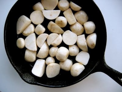 turnips in a skillet before cooking 
