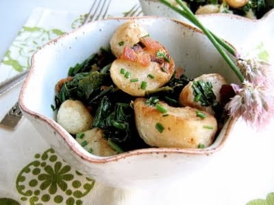 bowl of roasted turnips with wilted turnip greens