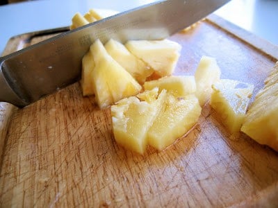 chopping pineapples
