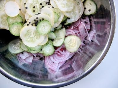 cucumbers and onions in a bowl 