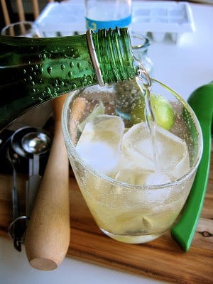 tonic poured into gin 