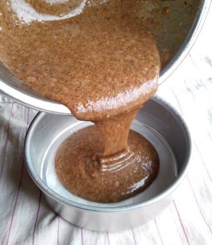 cake mix being poured into a tin