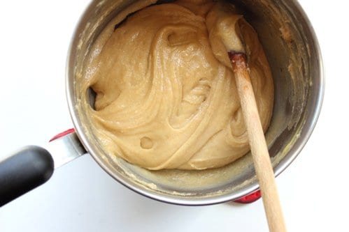 gougere mix being stirred in a pot 