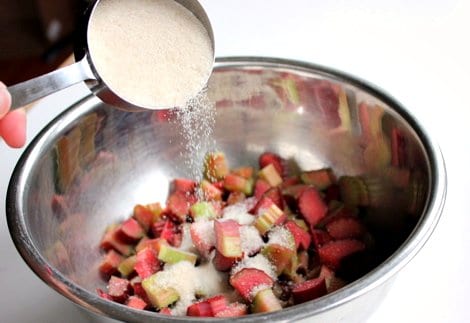 sugar poured onto rhubarb