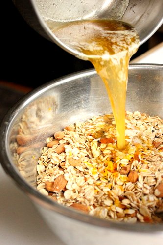 melted butter poured onto granola 