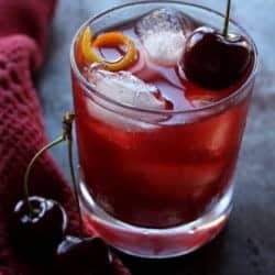 glass of sweet cherry manhattan