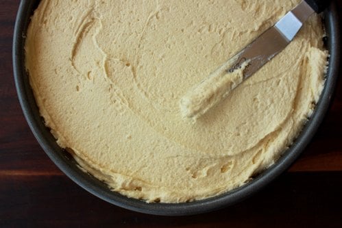 cake mix being spread 