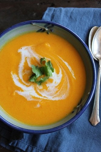 curried carrot soup with coconut milk in a bowl 