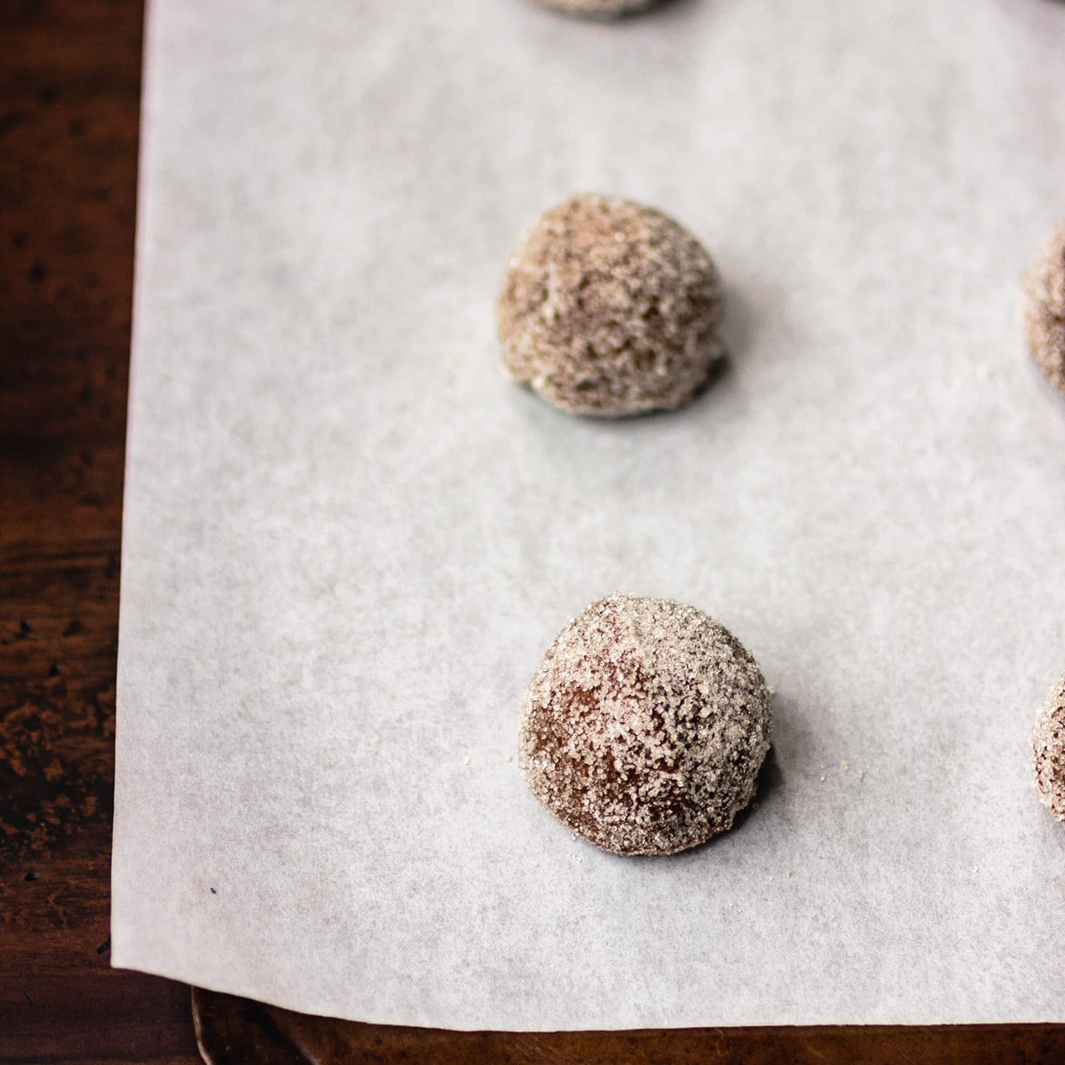 dough balls have been placed on a cookie sheet to bake