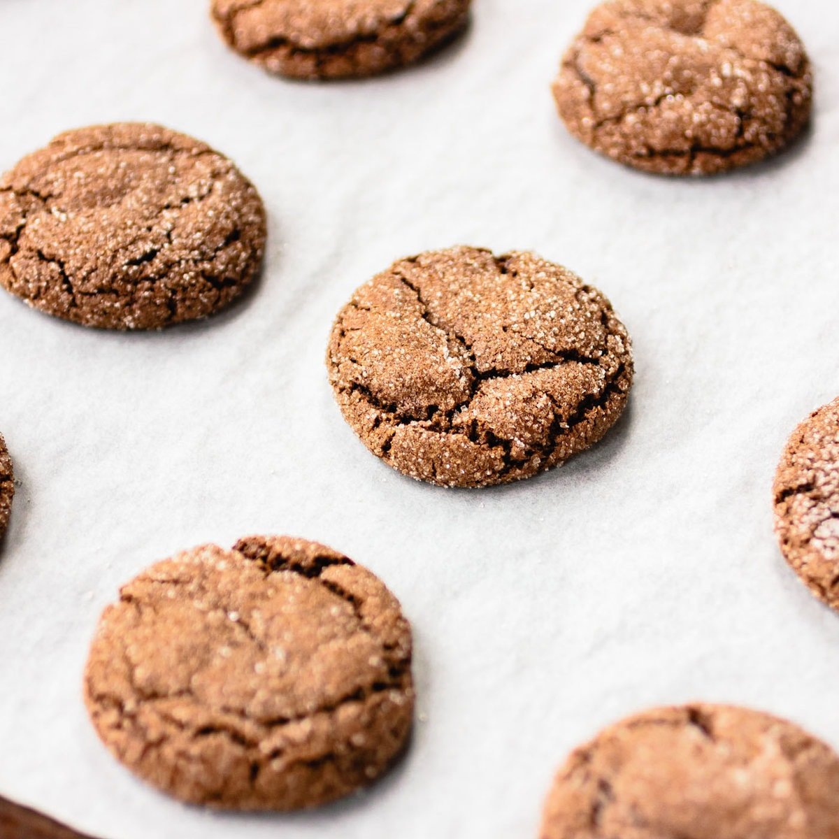 freshly baked cookies are on a sheet pan looking perfectly crinkly and delicious