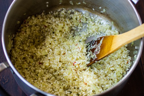 rice being stirred in pot 