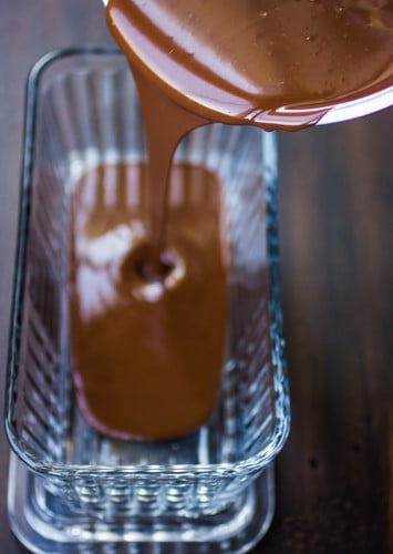 truffle mix being poured into a dish 