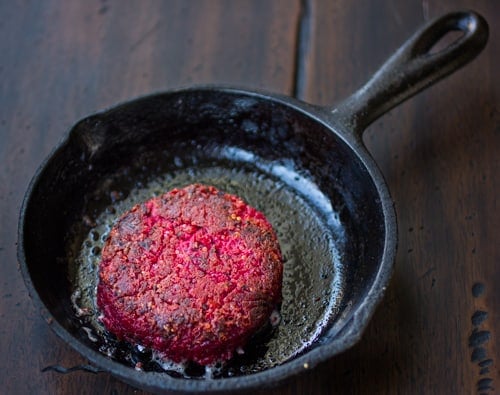 quinoa beetroot chickpea burger cooking in a pan 