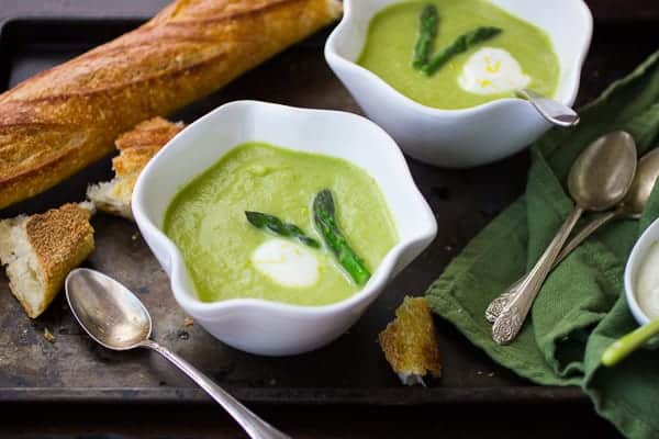 bowls of asparagus leek and green garlic soup 