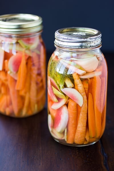 carrot and watermelon radish pickle in jars 