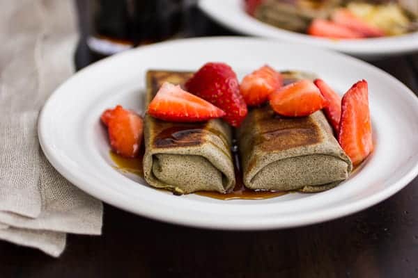 two buckwheat cheese blintzes on a plate 