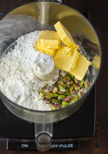 butter pistachios and flour in a blender 