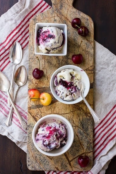 bowls of roasted cherry vanilla ice cream on a board 