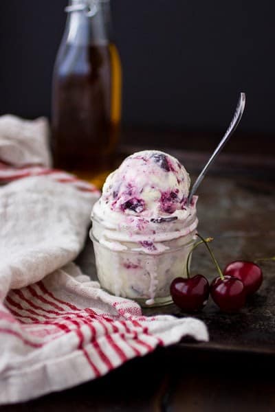 scoop of roasted cherry vanilla ice cream in a glass 