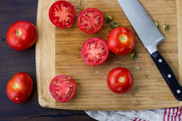 tomatoes on chopping board 