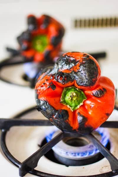 peppers roasting on a hob 