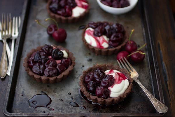 chocolate cherry goat cheese tarts on a baking tray 