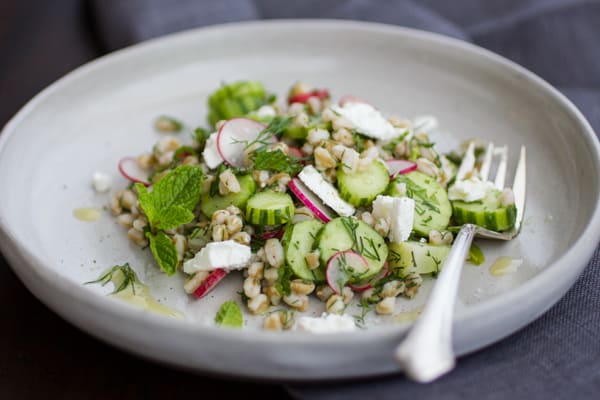 side shot of Farro and Cucumber Salad with Feta, Dill and Mint on a plate