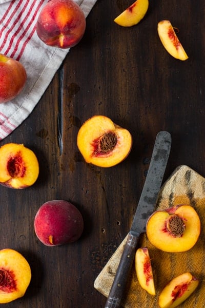 peach halves on a table 