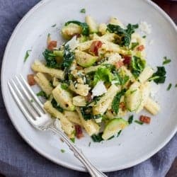 Pasta alla Carbonara with Kale, Brussels Sprouts, and Bacon on a plate