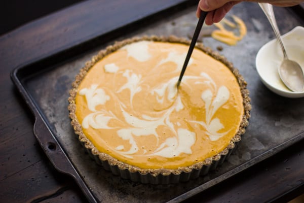 swirls being made on top of Marbled No-Bake Pumpkin Pie (Grain-Free and Vegan)